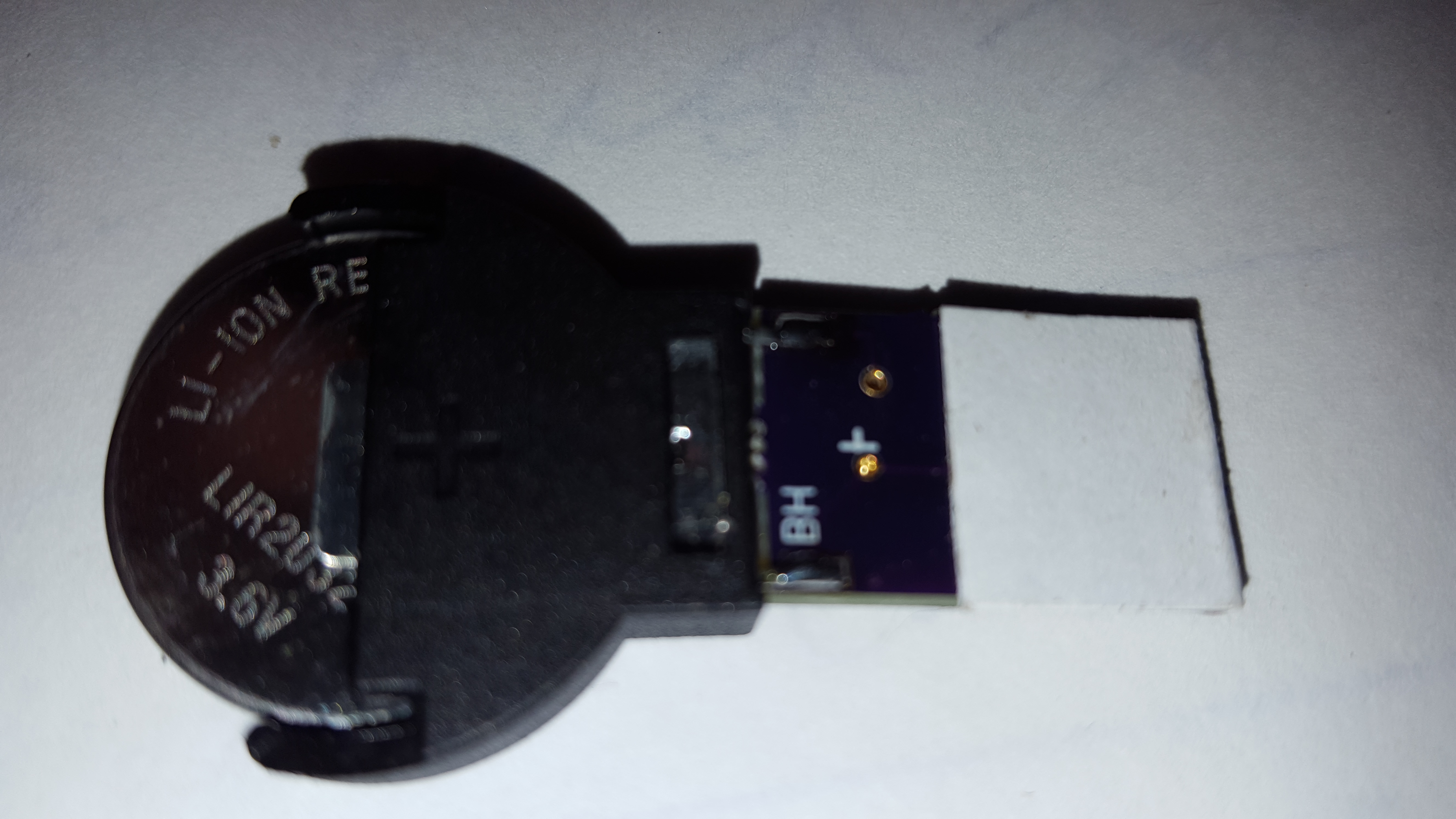button cell charger
